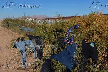 Migrants seeking asylum in the United States gather on the banks of the Rio Bravo river in Ciudad Juarez