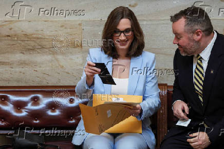 Incoming U.S. Representative Sarah McBride (D-DE) looks at a packet of new member information at the U.S. Capitol