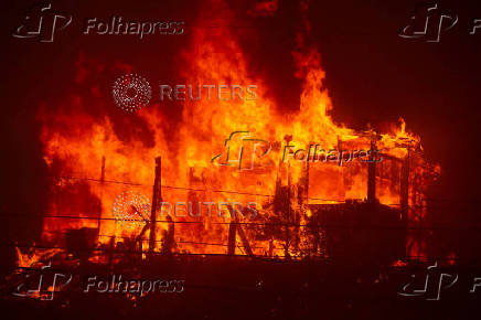 Palisades Fire burns during a windstorm on the west side of Los Angeles