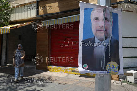 A poster of presidential candidate Mohammad Bagher Ghalibaf ?is displayed on a street in Tehran