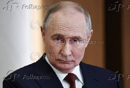 Russian President Putin attends a press conference in Astana