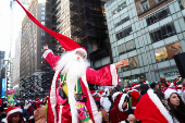 Revellers take part in SantaCon in New York City