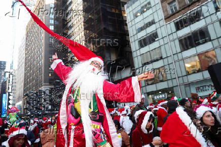 Revellers take part in SantaCon in New York City