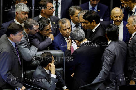 Congressmen attend a session of the National Congress at the plenary chamber of deputies in Brasilia