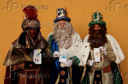 The Three Wise Men visit children and elderly people, ahead of the Epiphany parade, in Ronda