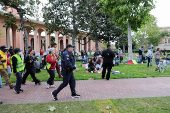 Students build a protest encampment in support of Palestinians, at USC in Los Angeles
