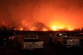 Smoke billows from the Mountain Fire, in California