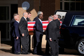 Former U.S. President Carter's casket travels to Atlanta, Georgia