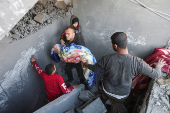 Aftermath of Israeli strike on a house in Nuseirat, in the central Gaza Strip