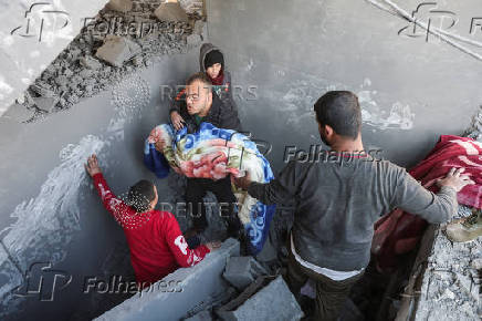 Aftermath of Israeli strike on a house in Nuseirat, in the central Gaza Strip