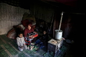 Afghans living in a camp amidst drop in temperatures in Kabul