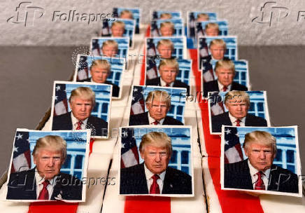 Ursula Trump presents pastries decorated with an eatable portrait of U.S. President-elect Donald Trump in a bakery in Freinsheim