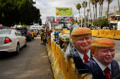 Busts of U.S. President Donald Trump are displayed at the San Ysidro border crossing, in Tijuana