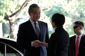 Indonesian Foreign Minister Retno Marsudi greets Chinese foreign minister Wang Yi before their meeting in Jakarta