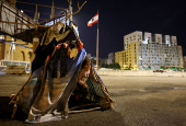 Families spend the night at Beirut's central Martyrs' Square after fleeing the ongoing Israeli strikes in southern Beirut