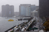 Traffic is seen along 1st Avenue during a rainy day in New York