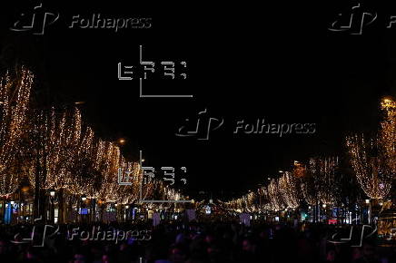 Paris Olympics chief Estanguet turns on Christmas lights on the Champs Elysees