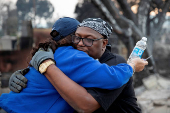 Desiree Johnson views her home that was destroyed by the Eaton Fire in Altadena