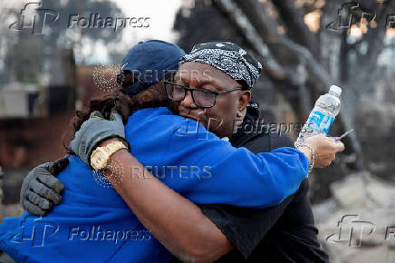 Desiree Johnson views her home that was destroyed by the Eaton Fire in Altadena