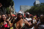 Revellers take part in the 'Chora Me Liga' block party during a pre-Carnival parade in Rio de Janeiro