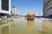 A truck drains flood water following heavy rainfall in Dubai