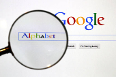 FILE PHOTO: Google search page is seen through a magnifying glass in this photo illustration