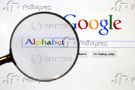 FILE PHOTO: Google search page is seen through a magnifying glass in this photo illustration