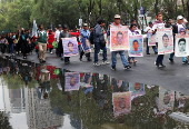 People march to demand justice for missing students from Ayotzinapa Teacher Training College, in Mexico City