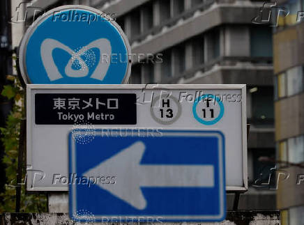 Tokyo Metro's logo on a subway station is pictured on the day the company makes  debut on the Tokyo Stock Exchange in Tokyo