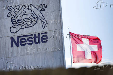 A Swiss flag flutters on the headquarters of Nestle in Vevey