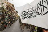 Khaled Brigade, a part of Hay'at Tahrir al-Sham (HTS), hold a military parade, in Damascus