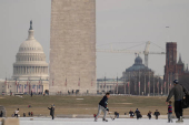 People skate on the ice-covered Lincoln Memorial Reflecting Pool on the National Mall, in Washington