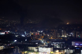 Smoke billows over Beirut's southern suburbs, as seen from Sin El Fil