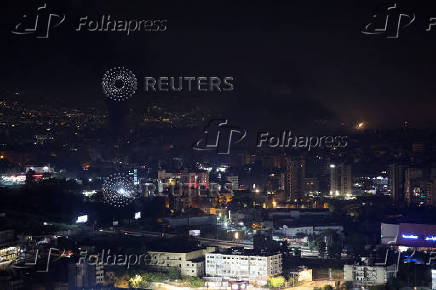 Smoke billows over Beirut's southern suburbs, as seen from Sin El Fil