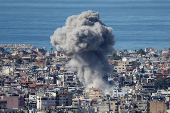 Smoke billows in Beirut's southern suburbs, after an Israeli strike