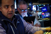 Traders work on the floor of the NYSE in New York