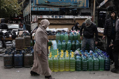 Containers filled with fuel sold on the black market in Damascus