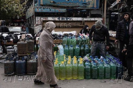 Containers filled with fuel sold on the black market in Damascus