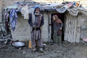 Afghans living in a camp amidst drop in temperatures in Kabul