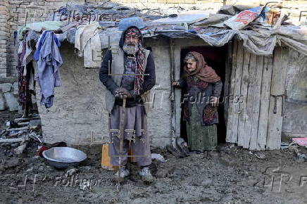 Afghans living in a camp amidst drop in temperatures in Kabul