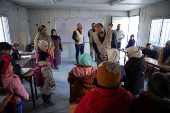 UNICEF Deputy Executive Director, Ted Chaiban, visits students inside a portable classroom in Aleppo