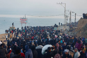 Displaced Palestinians wait to be allowed to return to their homes in northern Gaza, in the central Gaza Strip