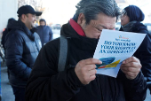 Immigrant rights flyers at a food pantry in Chelsea