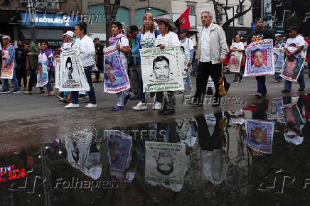 People march to demand justice for missing students from Ayotzinapa Teacher Training College, in Mexico City