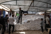 UNRWA agency hands out bags of flour to Palestinians in Khan Younis