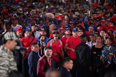 Members of the Bolivarian Militia and supporters of President Nicolas Maduro march to plead allegiance