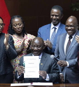 South Africa President Cyril Ramaphosa signs the National Health Insurance Bill into law
