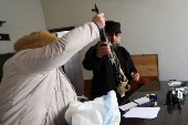 Former members of Syria's Bashar Al Assad's security forces wait to register for the identification and reconciliation process, in Damascus