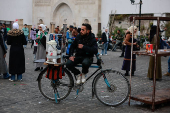 People walk at a traditional souq in the Bab Touma district of the Old City of Damascus