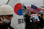 Pro-Yoon supporters participate in a rally outside the Seoul Detention Center in Uiwang